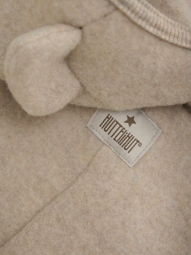 Lys beige Huttelihut ullfleece kjeldress med ører unisex barn 1–18 mnd