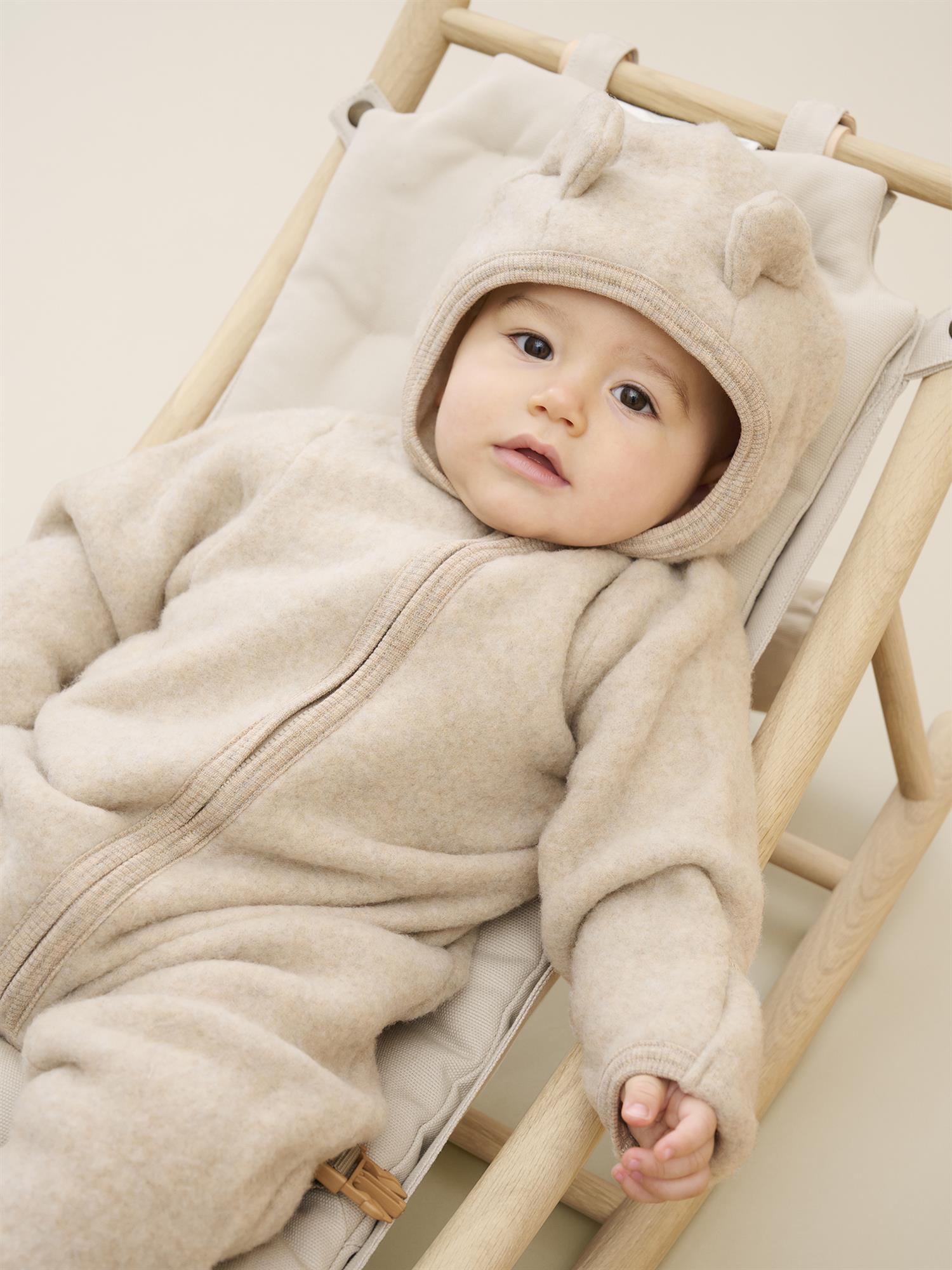 Lys beige Huttelihut ullfleece kjeldress med ører unisex barn 1–18 mnd