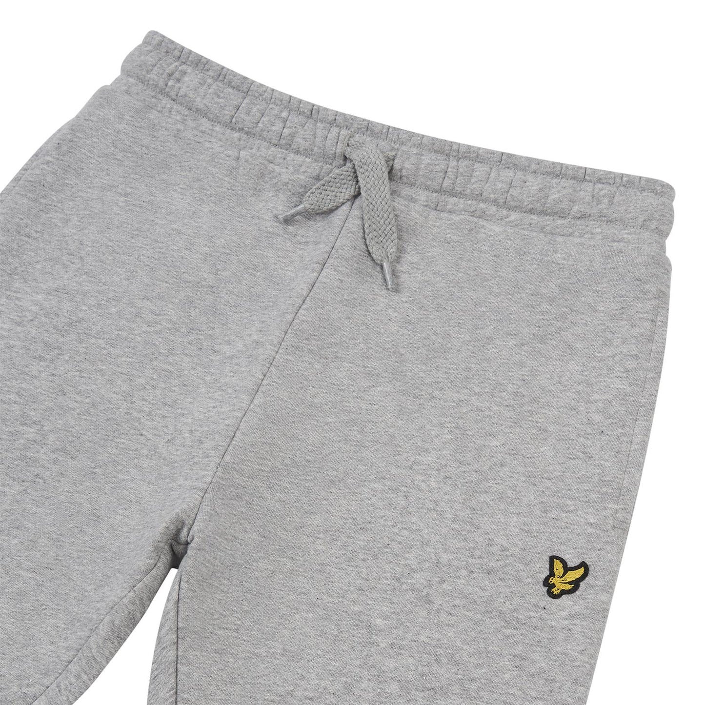Lyle & Scott grå joggebukse med lommer og gul logo – sett forfra og fra siden.